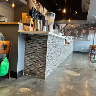 a woman sitting at a table in a restaurant