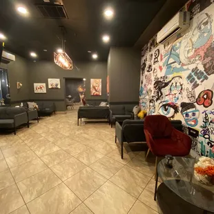 a living room with couches and chairs