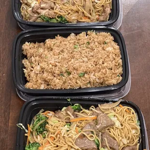 Pork noodles, beef noodles and fried rice in take out containers.