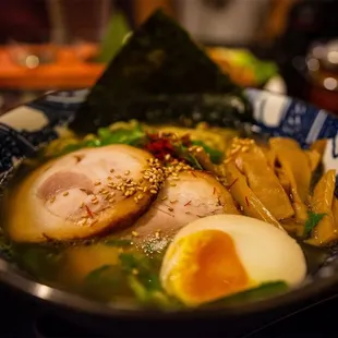 a bowl of ramen with a boiled egg