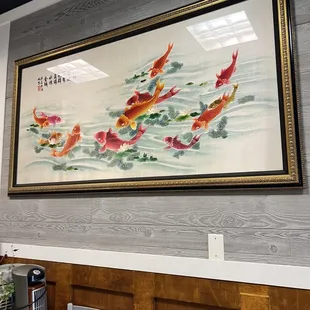 a painting of koi fish