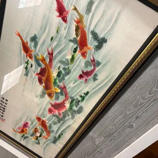 a painting of koi fish