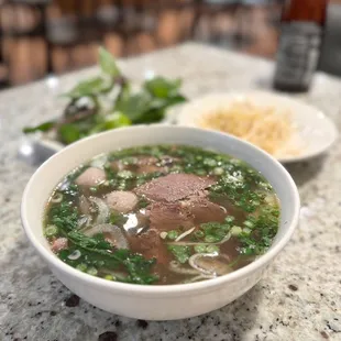 Pho with ribeye rare steak, lean brisket, beef balls (phở tái, chín, bò viên)