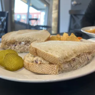 Fresh crab sander with a side of chips and drink