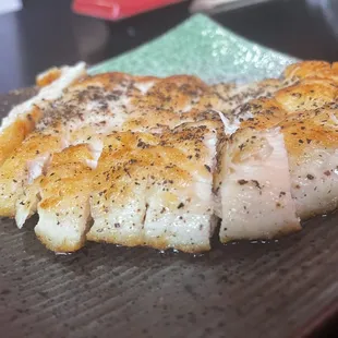 a piece of fish on a plate