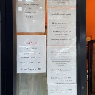 a menu in a restaurant window