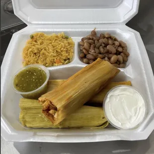 rice,beans,3 tamales,green salsa,sour cream.