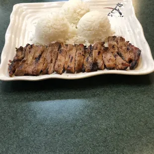 a plate of rice and meat