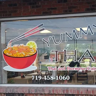 a sign in the window of a restaurant