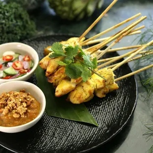 skewers of food on a plate