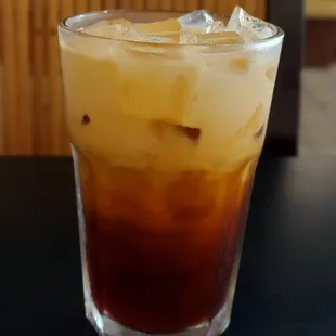 a tall glass of iced coffee