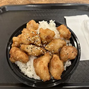 The Orange Chicken bowl over white rice. Could have used a little extra sauce for the rice. But otherwise yummy!