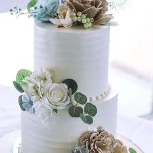 Custom wedding cake Vanilla with Raspberry Cake on bottom tier and Red Velvet Cake on the top tier