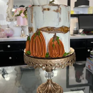 a cake with pumpkins on top