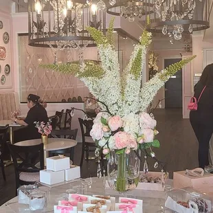 a table of pastries and flowers