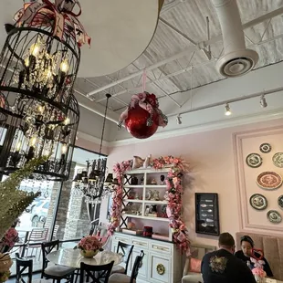 a dining area with a chandelier