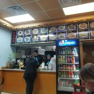 a woman ordering food at a restaurant