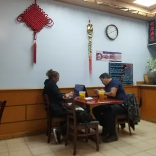 two people sitting at a table