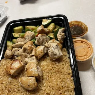 Yummy fresh delicious chicken with garlic rice and sauté veggies