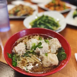 a plate of dumplings and broccoli