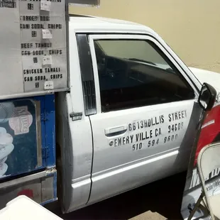 a white truck parked in front of a building