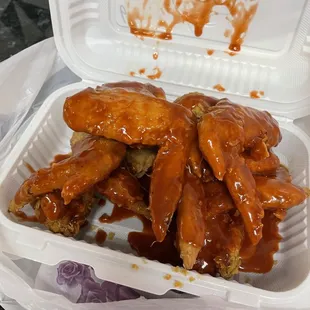 chicken wings in a styrofoam container