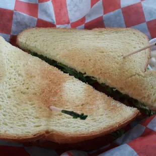 a sandwich cut in half with a toothpick