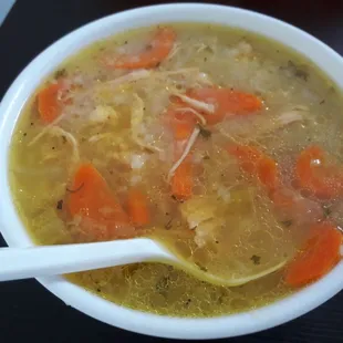 a bowl of soup with carrots