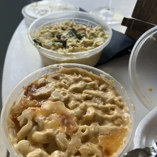 Mac &amp; cheese in the forefront, and potato salad in the background.