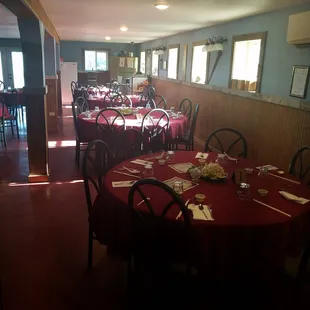 a dining room with tables and chairs