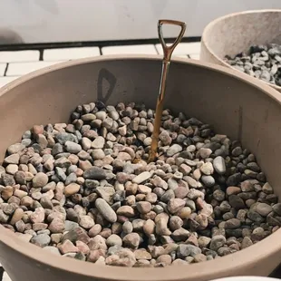 Decorative stone with the golden shovel ready