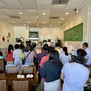 a large group of people in a restaurant
