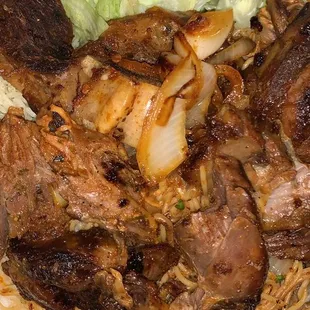 Goat meat with rice, salad, &amp; noodles ... DELICIOUS