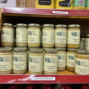 a shelf full of jars of food