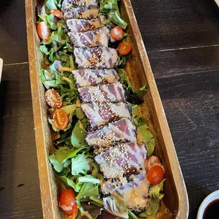 a salad with meat and vegetables