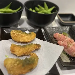 Yummy.  Shrimp tempura $10, Toro $22, Salmon belly $12.  Complementary edamame.