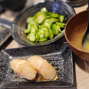 Scallop nigiri, miso soup and cucumber salad