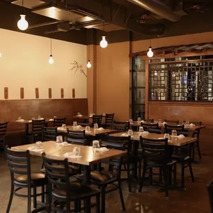 a dining room with tables and chairs