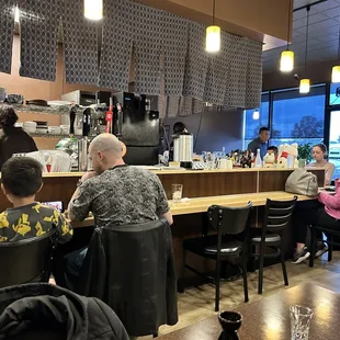 Yuzu's small dining area and open kitchen layout