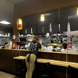 Front counter with kitchen and staff
