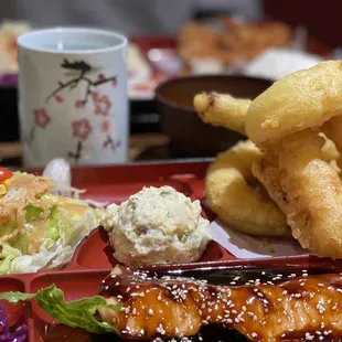 Bento box with Salmon Teriyaki and Mixed Tempura.
