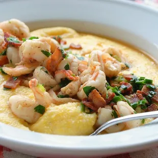 a bowl of shrimp and grits