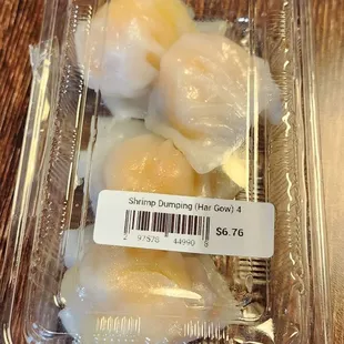 three boiled eggs in a plastic container
