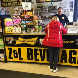 a woman standing at a counter