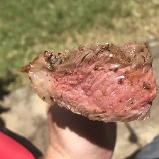 Ribeye medium rare goodness from a charcoal Webber grill. Coated in olive oil and salt n pepper. 6 minutes each side.