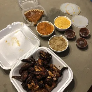 A night of chicken wings Mac cheese candied yams and cabbage and sweet potato pie for dessert
