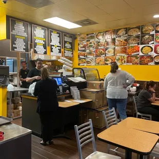 Order counter with menu items pictures on the wall!