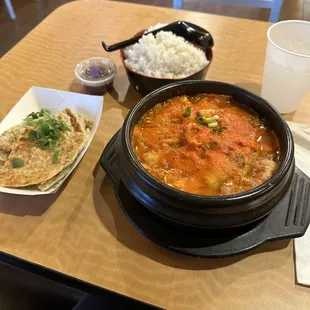 Kimchi soup with a side of green onion pancakes.