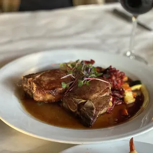 a plate of food and a glass of wine
