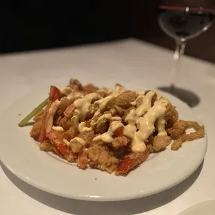 a plate of food and a glass of wine